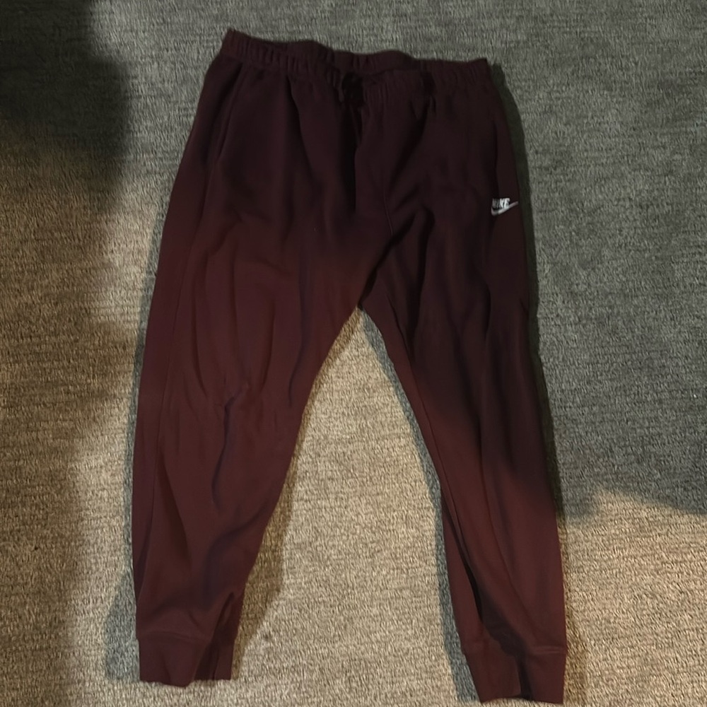 Red Nike joggers